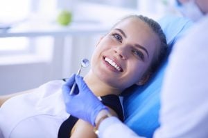a smiling female dental patient