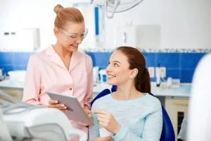 a dental patient looking at a tablet