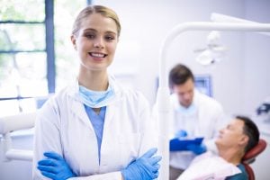 a smiling female dentist